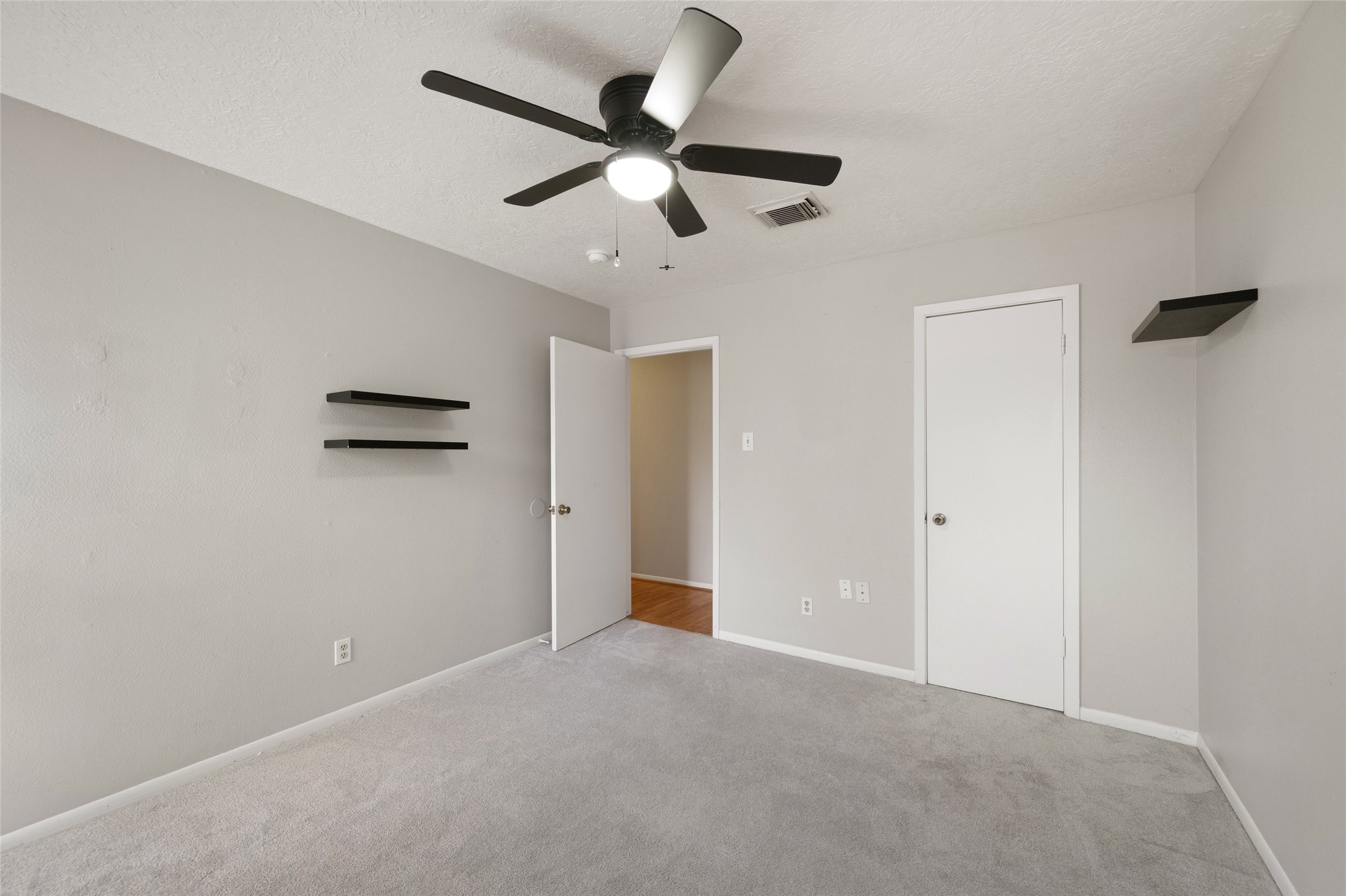 4205 Lariat Drive Baytown, TX 77521 - Photo 23 of 31 a view of a livingroom with a ceiling fan and window