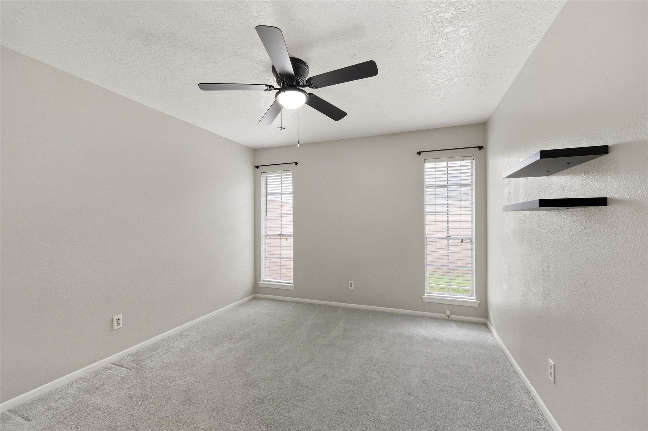 4205 Lariat Drive Baytown, TX 77521 - Photo 24 of 31 a view of an empty room with a window