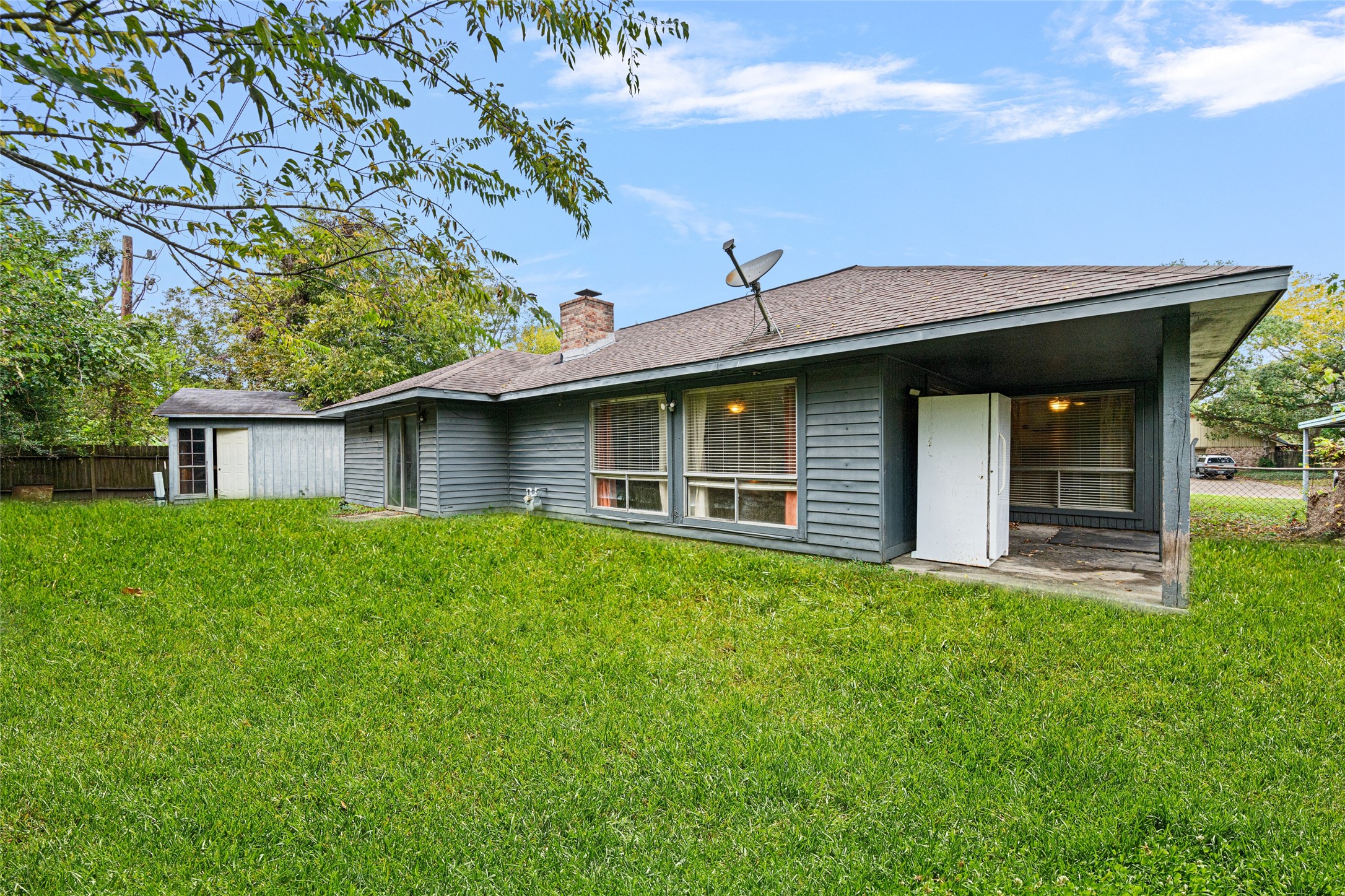 4205 Lariat Drive Baytown, TX 77521 - Photo 28 of 31 a front view of a house with a garden