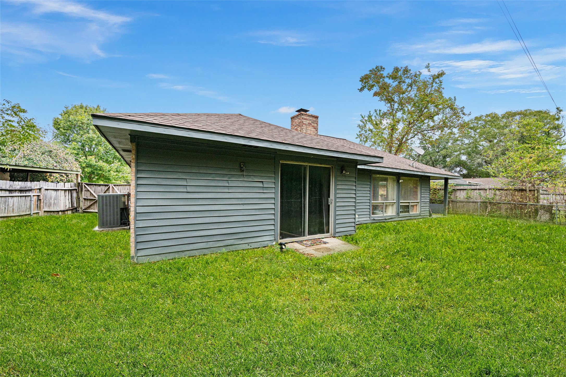 4205 Lariat Drive Baytown, TX 77521 - Photo 29 of 31 a front view of a house with a garden