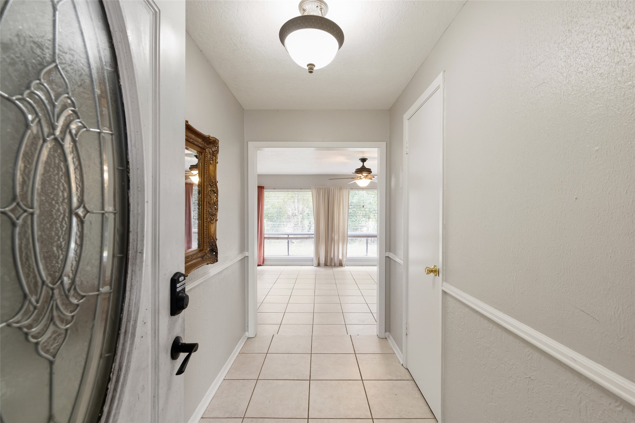 4205 Lariat Drive Baytown, TX 77521 - Photo 4 of 31 a view of a hallway with windows
