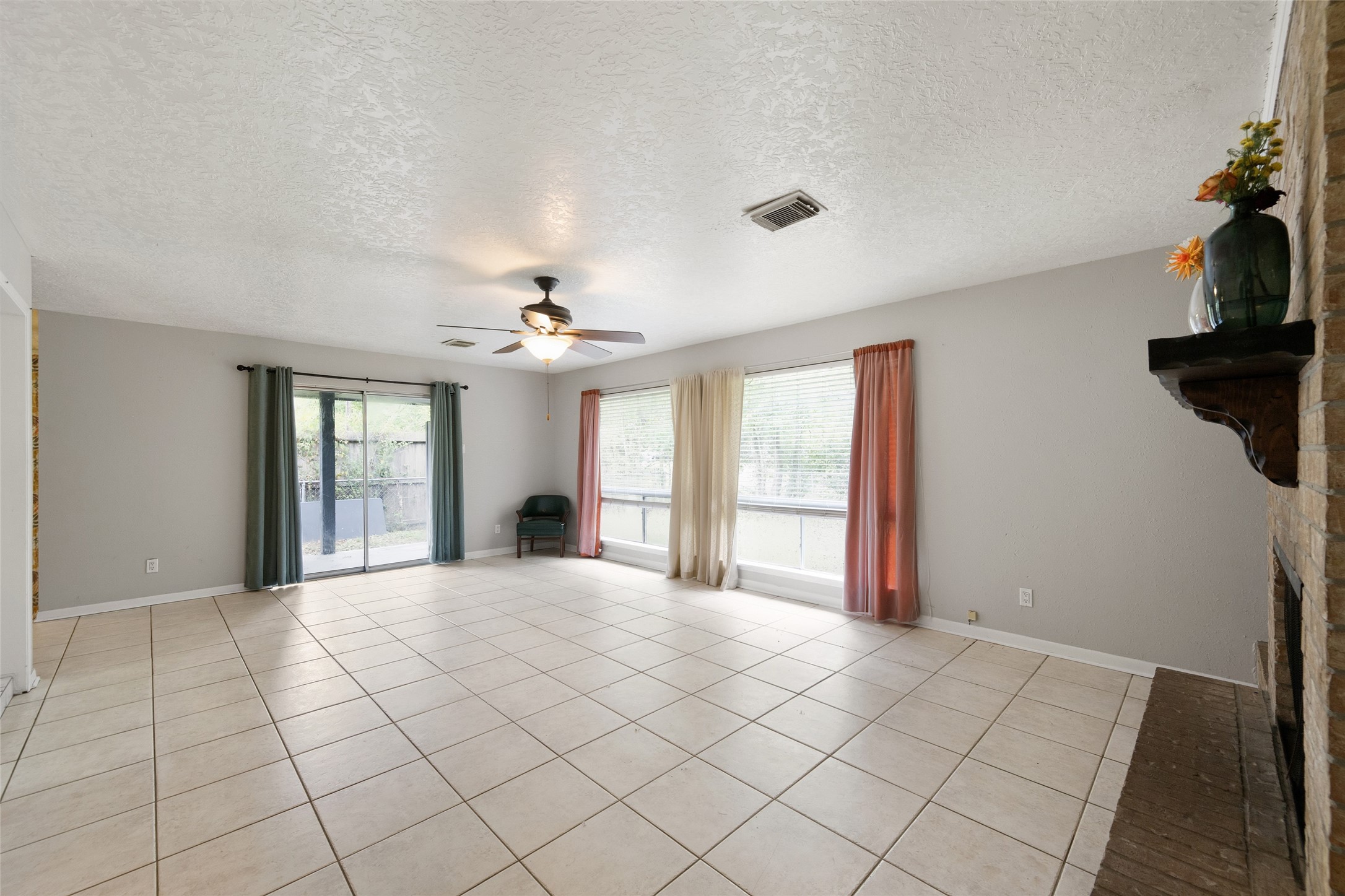 4205 Lariat Drive Baytown, TX 77521 - Photo 5 of 31 a view of an empty room with window and cabinet