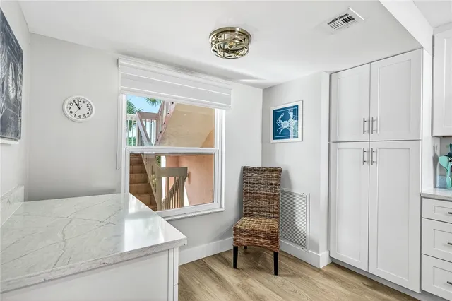 a view of room with window and lounge chair