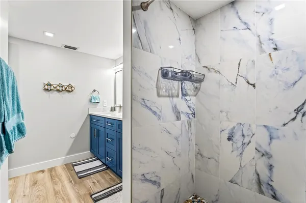 a bathroom with a bathtub and shower