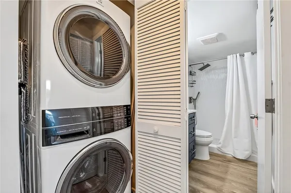 a view of a hallway with washer and dryer
