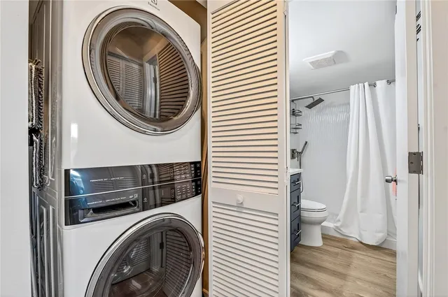a view of a hallway with washer and dryer