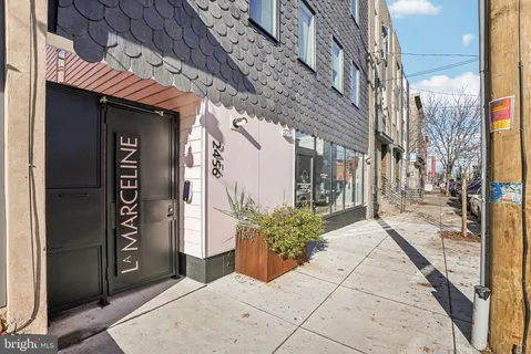 a view of a pathway along the building