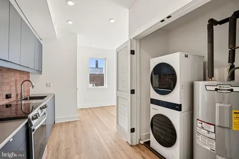 a view of a kitchen with washer and dryer