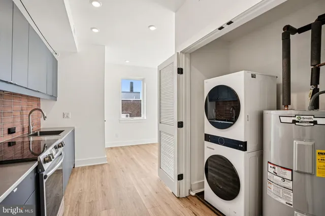a view of a kitchen with washer and dryer