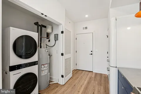 a view of a hallway with washer and dryer