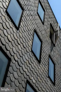 a view of path along with retail shop and buildings