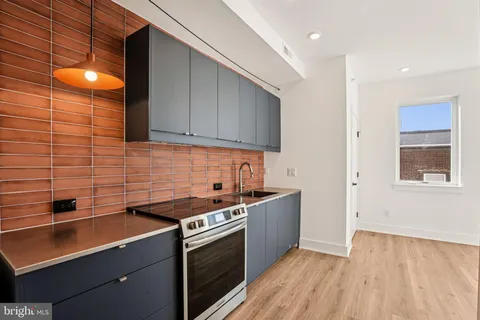 a kitchen that has a sink and cabinets