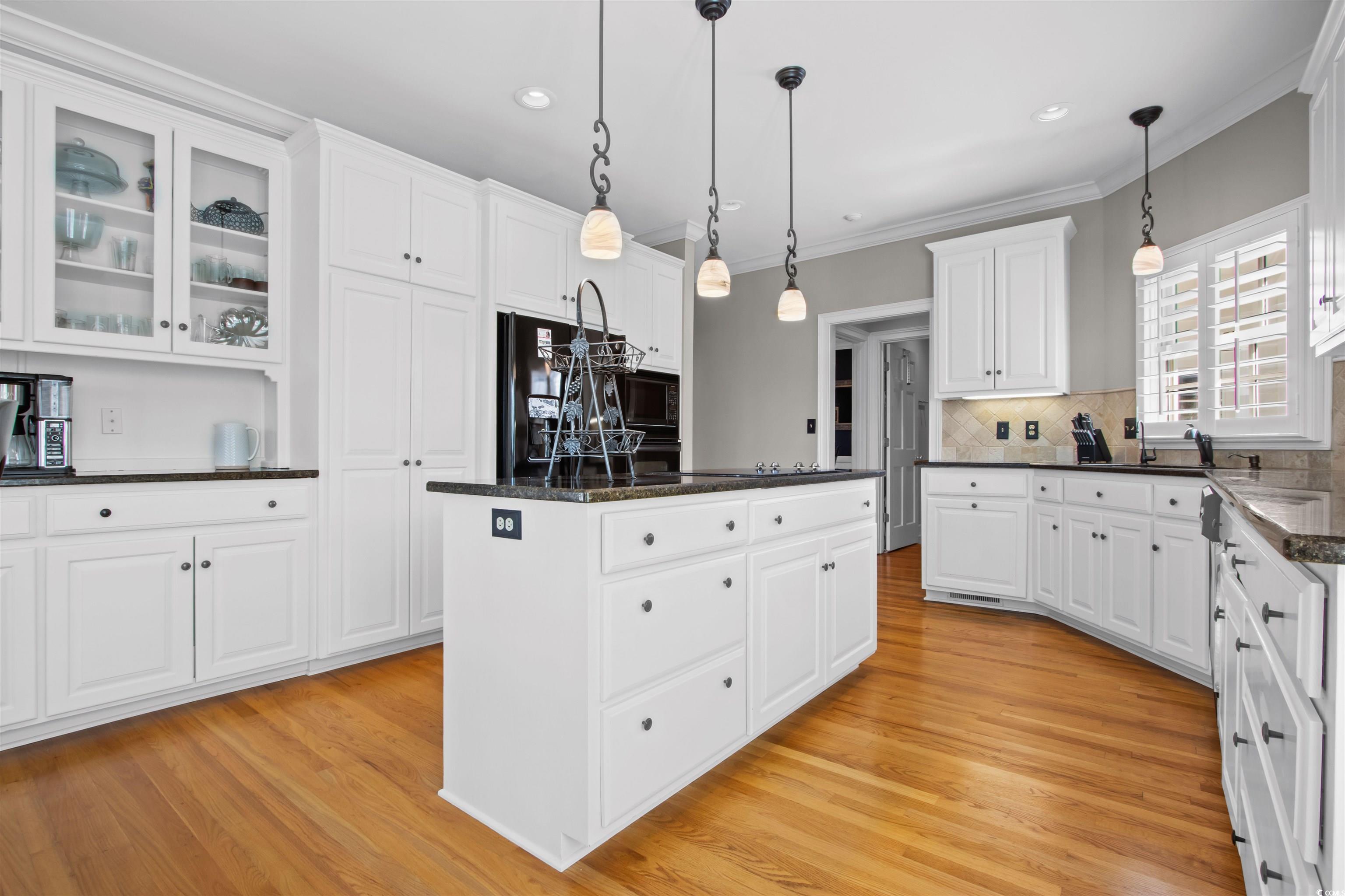 1035 Gullane Court Myrtle Beach, SC 29575 - Photo 11 of 40 Kitchen featuring light hardwood / wood-style floo