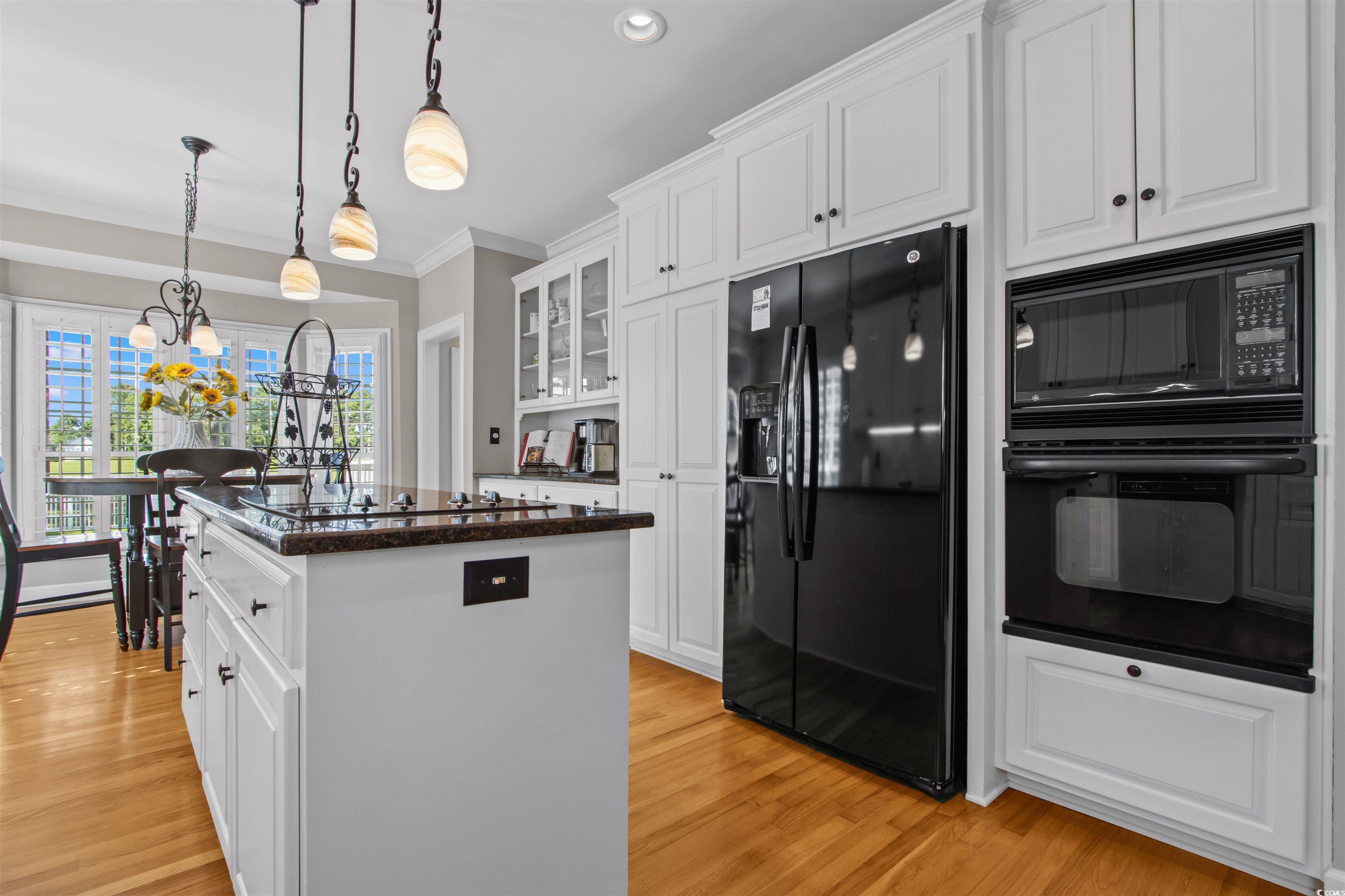 1035 Gullane Court Myrtle Beach, SC 29575 - Photo 12 of 40 Kitchen with crown molding, light wood-type floori