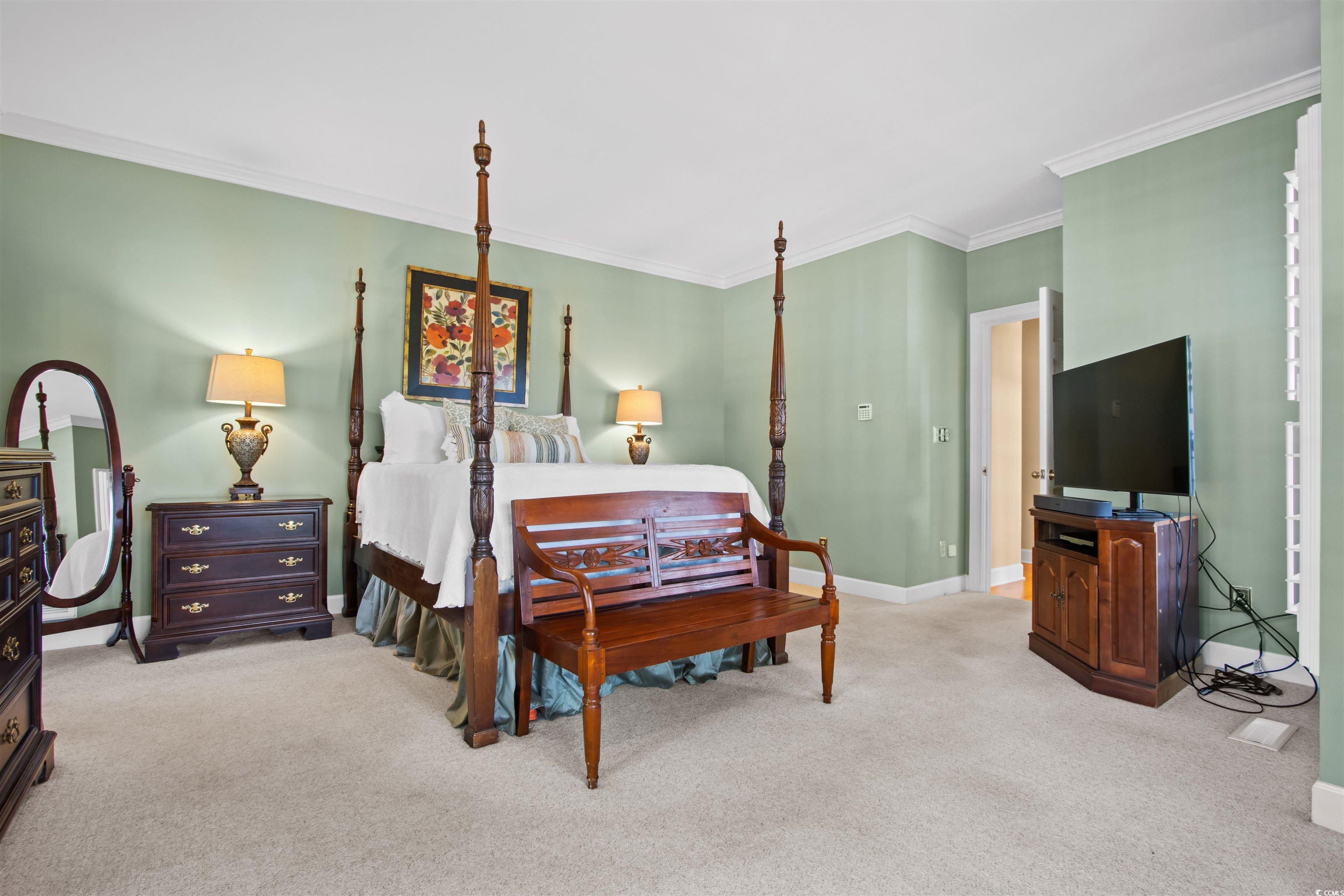 1035 Gullane Court Myrtle Beach, SC 29575 - Photo 19 of 40 Carpeted bedroom with ornamental molding