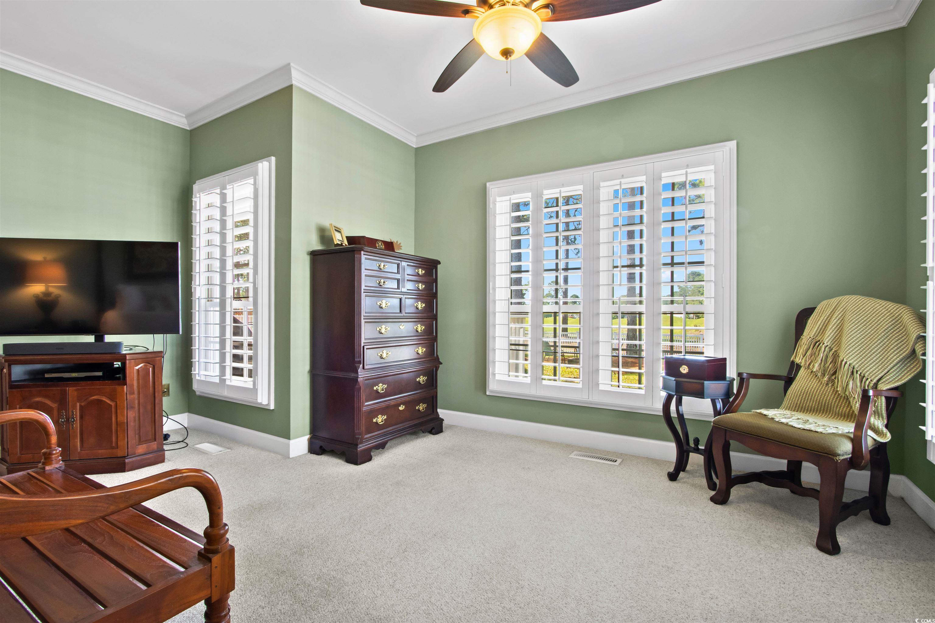 1035 Gullane Court Myrtle Beach, SC 29575 - Photo 21 of 40 Sitting room featuring crown molding, ceiling fan,
