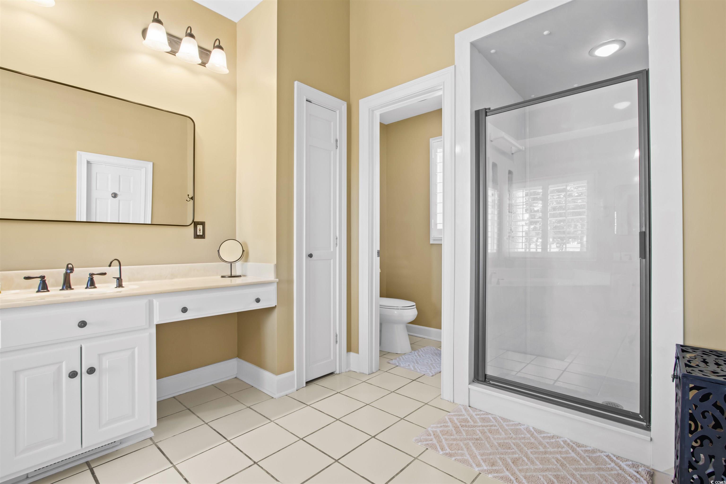 1035 Gullane Court Myrtle Beach, SC 29575 - Photo 22 of 40 Bathroom with toilet, vanity, tile patterned floor