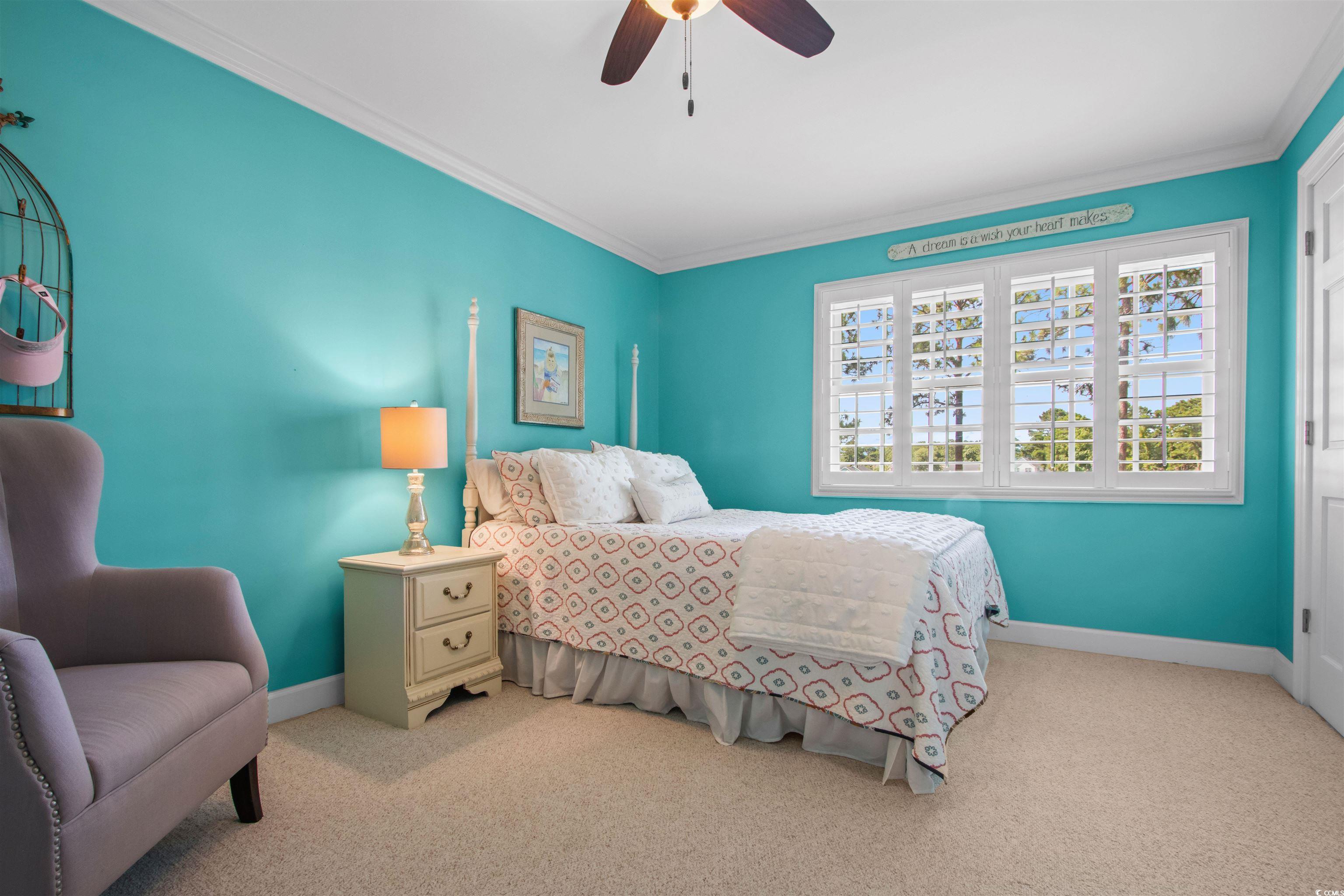 1035 Gullane Court Myrtle Beach, SC 29575 - Photo 24 of 40 Bedroom with ceiling fan, ornamental molding, and