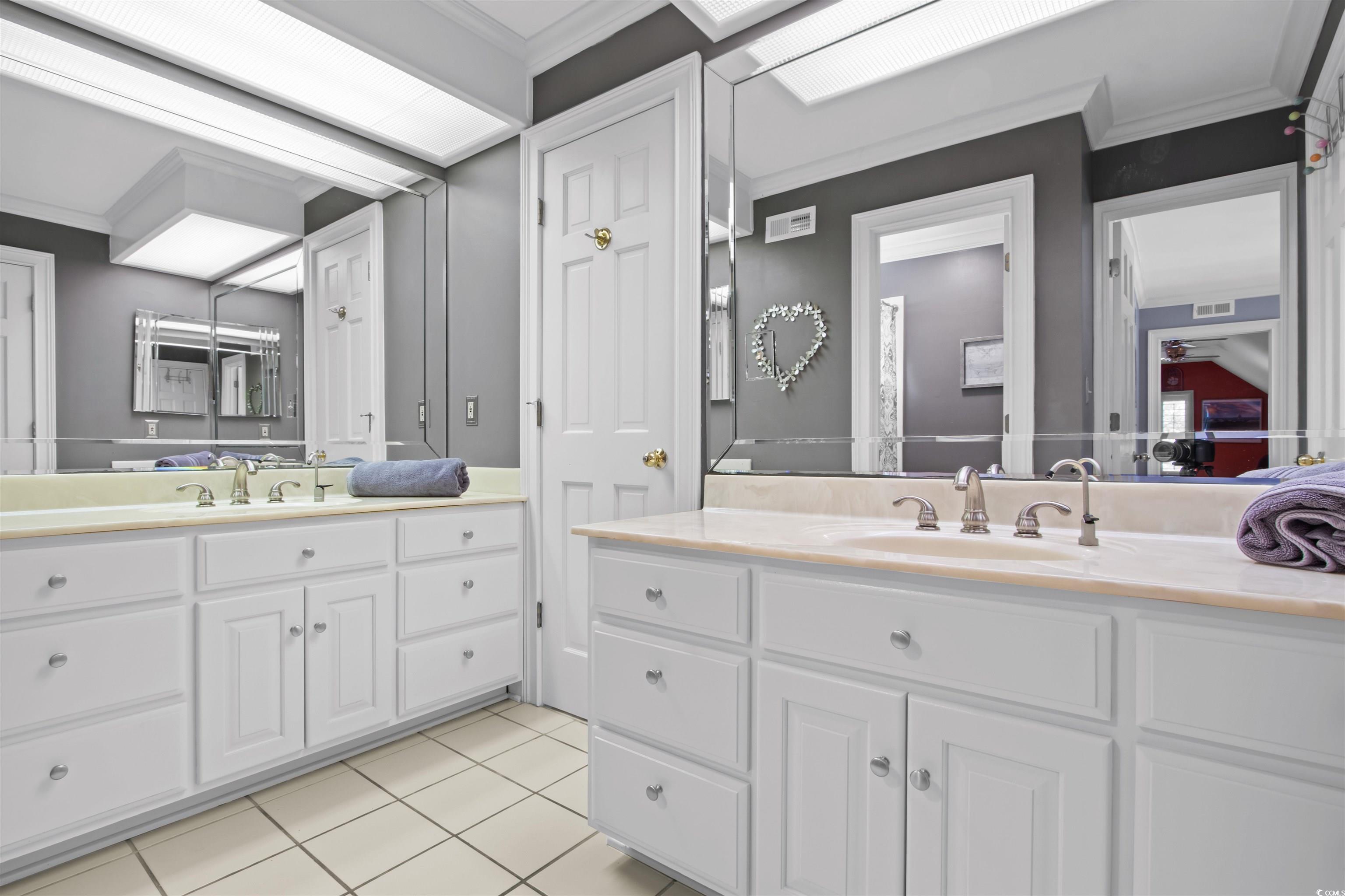 1035 Gullane Court Myrtle Beach, SC 29575 - Photo 26 of 40 Bathroom with ornamental molding, vanity, and tile