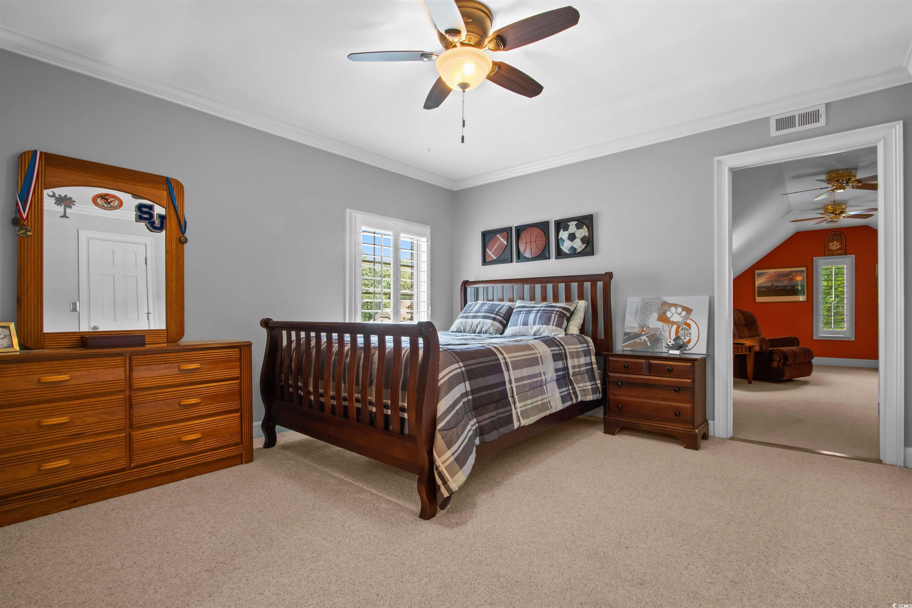 1035 Gullane Court Myrtle Beach, SC 29575 - Photo 28 of 40 Bedroom with ornamental molding, light colored car