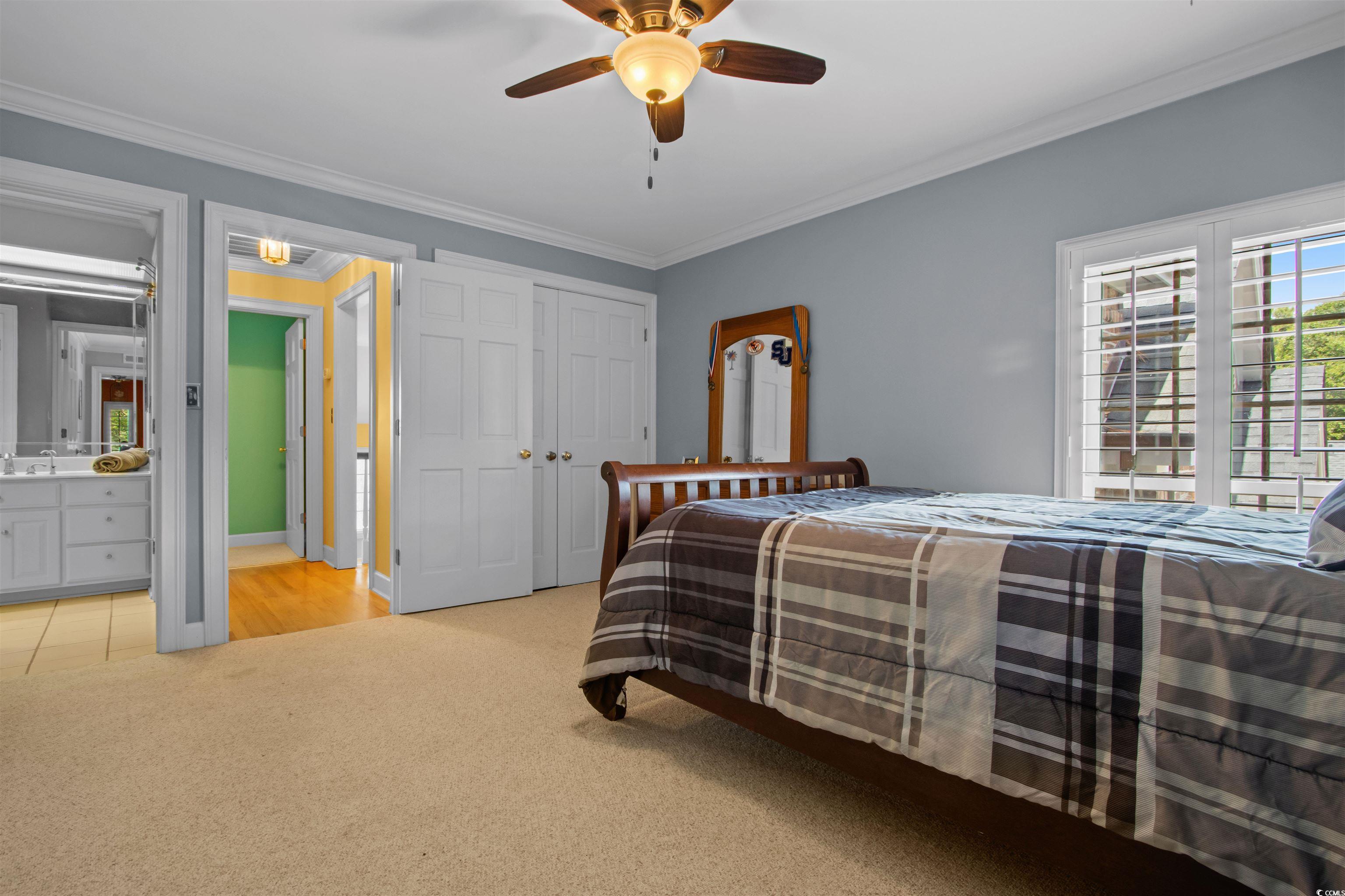1035 Gullane Court Myrtle Beach, SC 29575 - Photo 29 of 40 Bedroom with crown molding, ceiling fan, light col