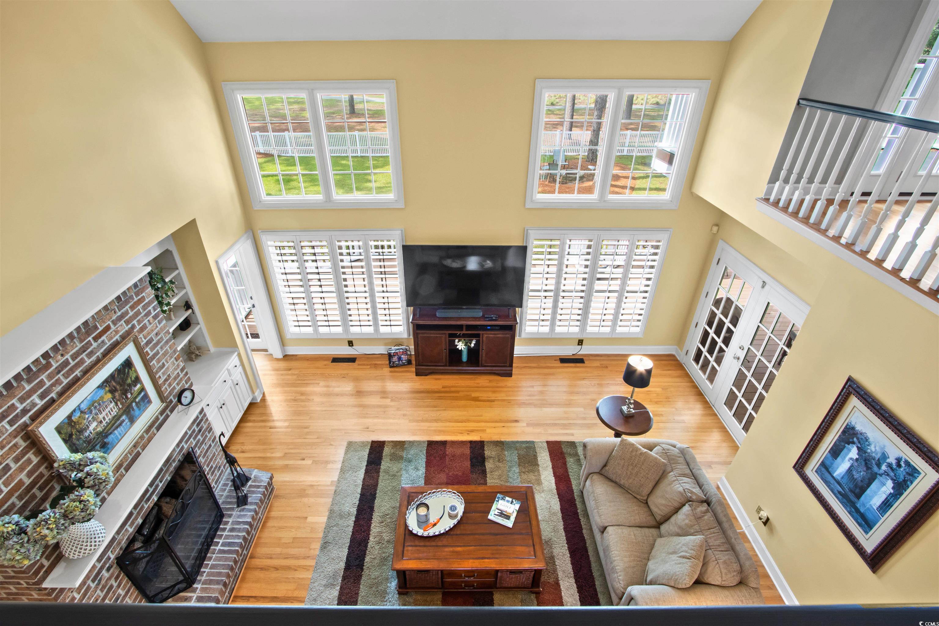 1035 Gullane Court Myrtle Beach, SC 29575 - Photo 31 of 40 Living room featuring a high ceiling, a fireplace,