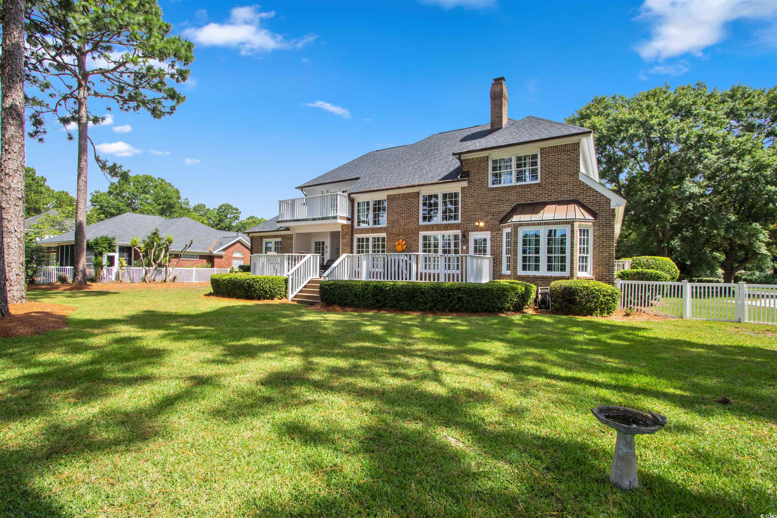 1035 Gullane Court Myrtle Beach, SC 29575 - Photo 36 of 40 Back of house with a yard and a wooden deck