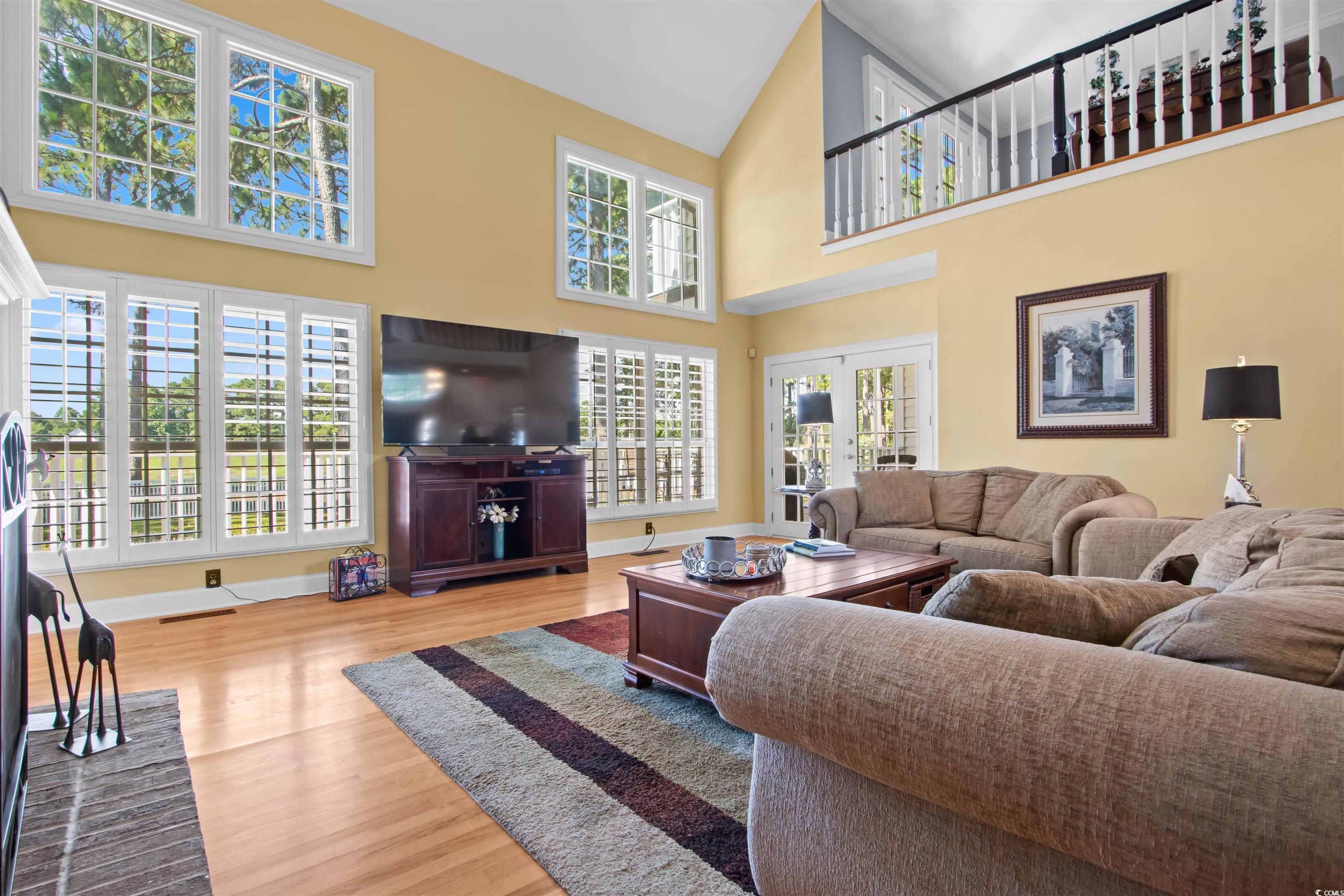 1035 Gullane Court Myrtle Beach, SC 29575 - Photo 5 of 40 Living room featuring high vaulted ceiling, light