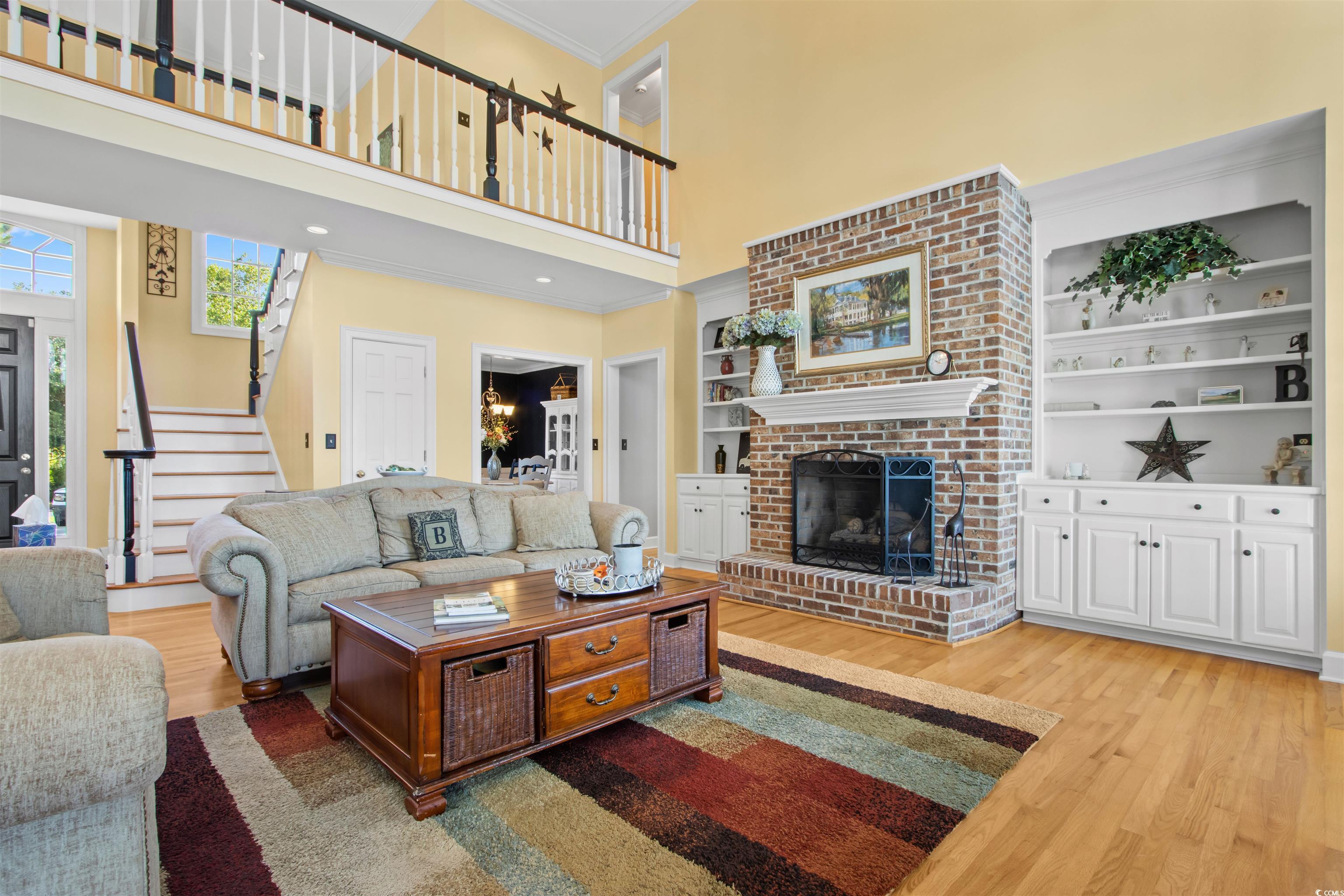 1035 Gullane Court Myrtle Beach, SC 29575 - Photo 6 of 40 Living room with ornamental molding, wood-type flo
