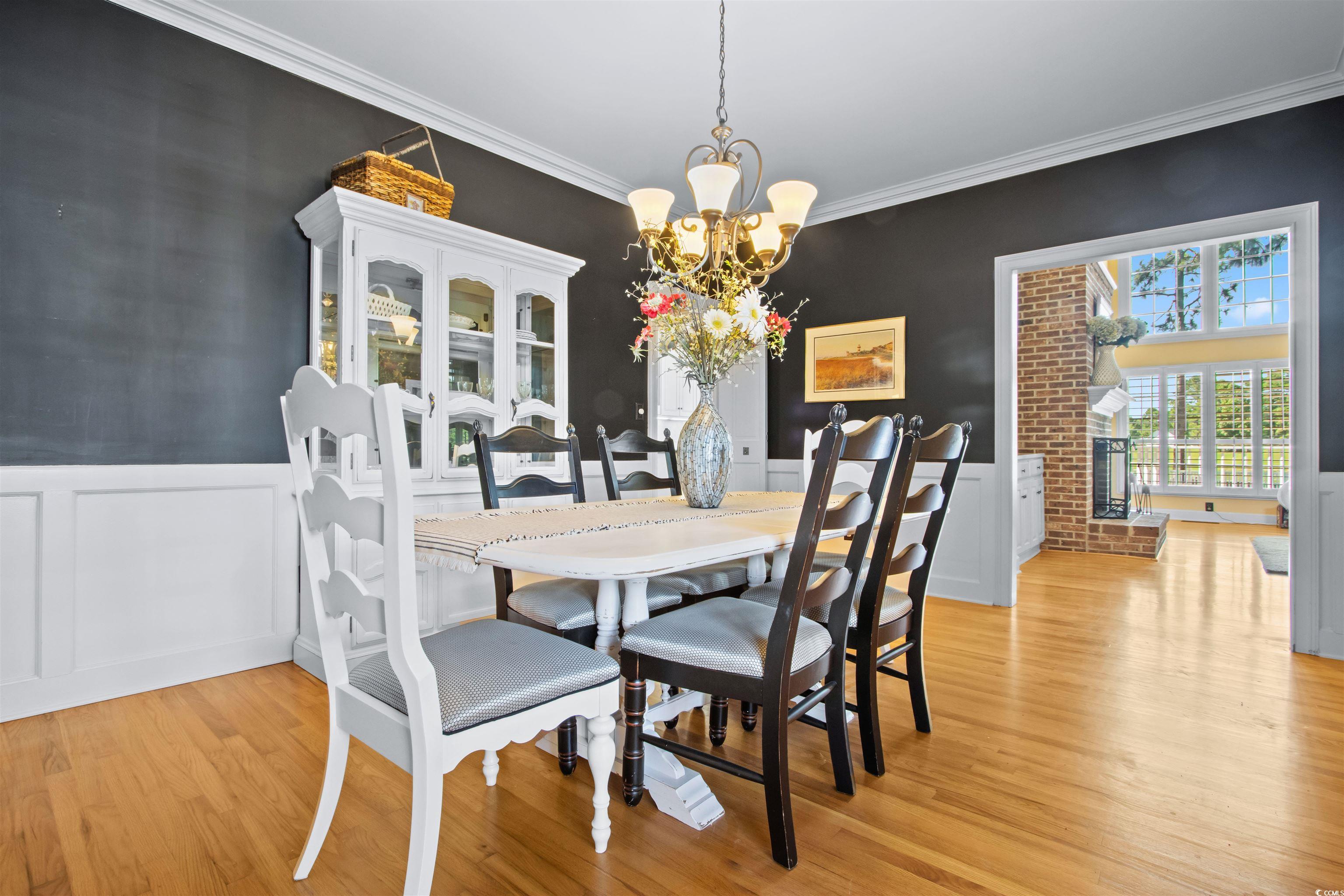 1035 Gullane Court Myrtle Beach, SC 29575 - Photo 8 of 40 Dining space with light hardwood / wood-style floo
