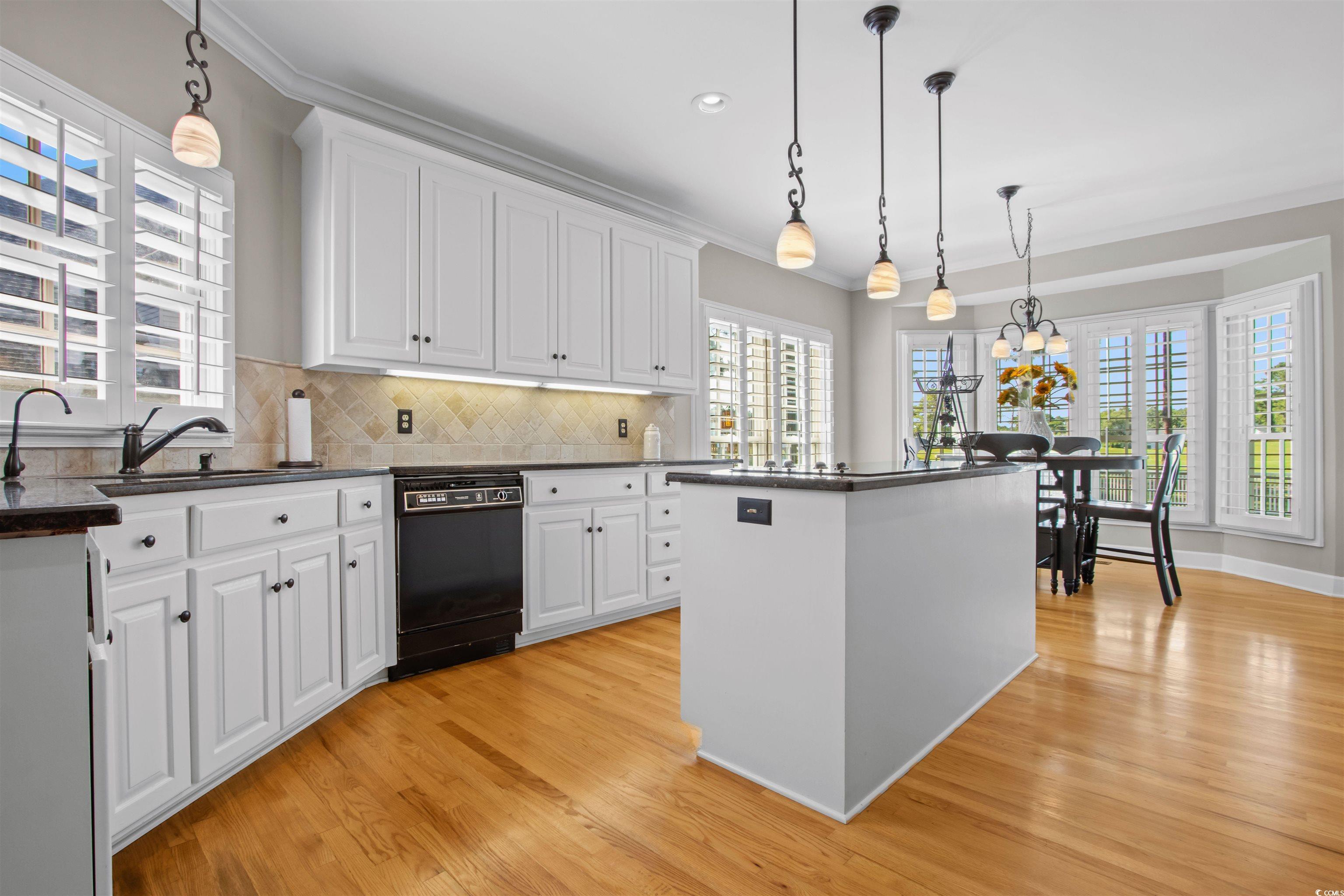 1035 Gullane Court Myrtle Beach, SC 29575 - Photo 10 of 40 Kitchen featuring dishwasher, light wood-type floo