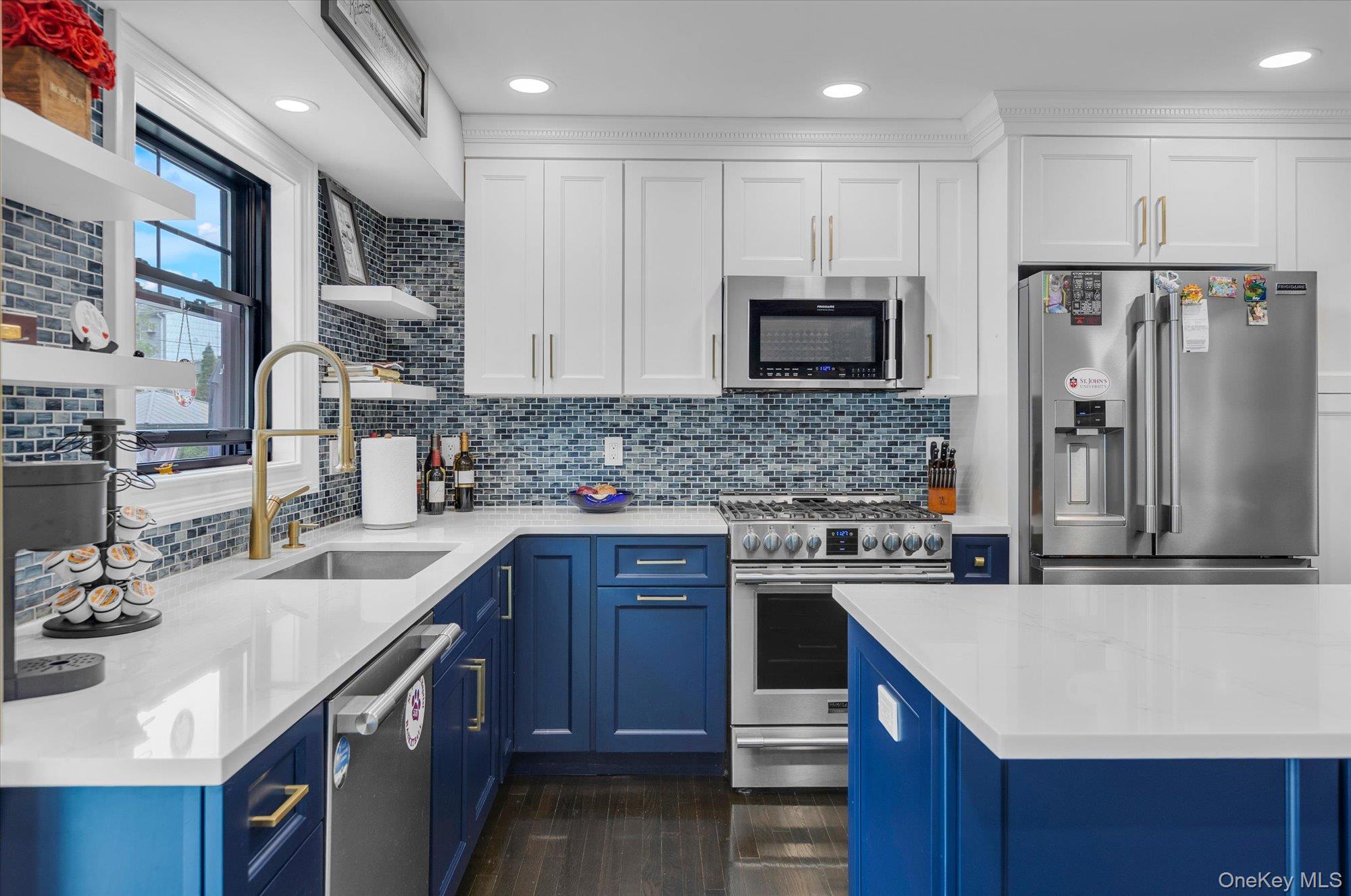 31 Apple Lane Commack, NY 11725 - Photo 7 of 28 Two tone cabinetry with stainless steel appliances and recessed lighting.