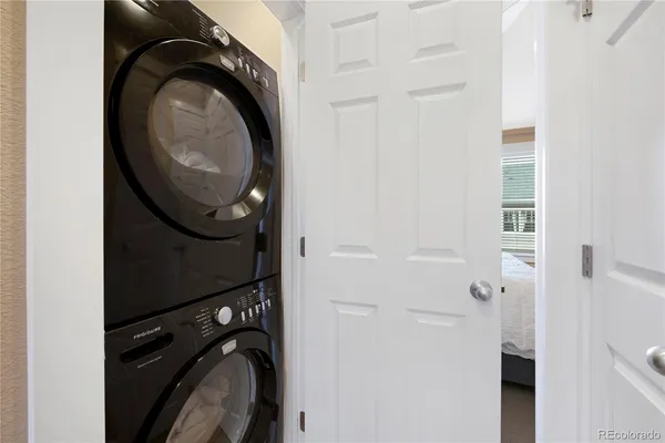 a close view of a utility room with dryer and washer