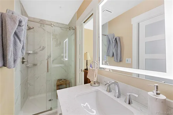 a bathroom with a sink and a shower