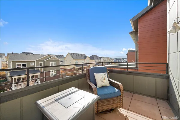 a terrace of a house with outdoor seating