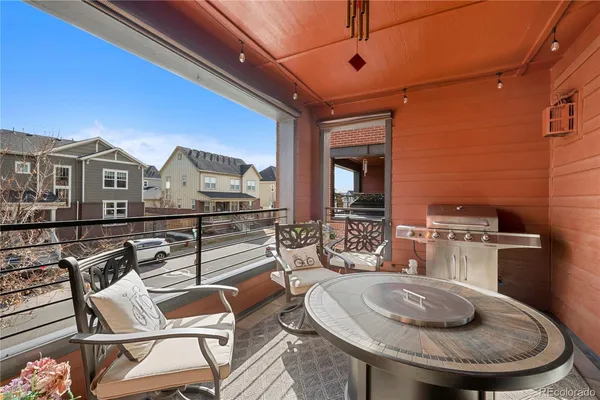 a dinning table and chairs in a patio