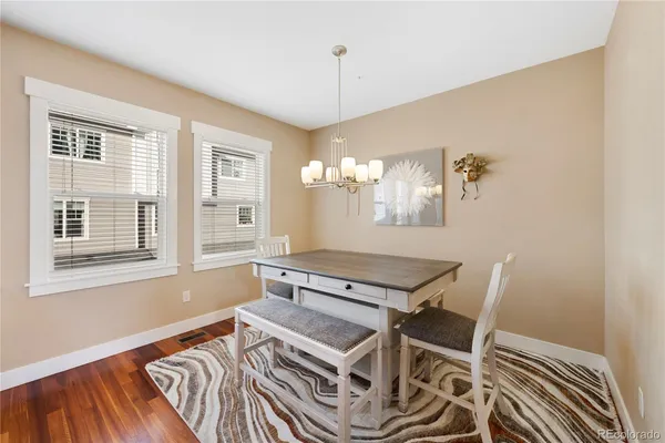 a living room with a bed and a table