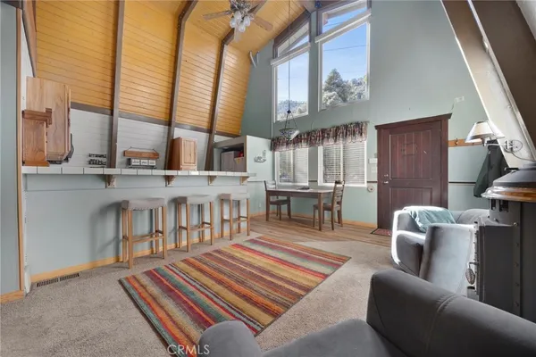 a kitchen with stainless steel appliances a sink a stove and a refrigerator