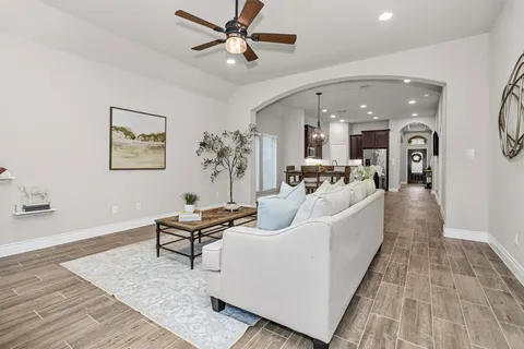a bedroom with a bed and a potted plant