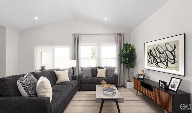 a bedroom with bed and wooden floor