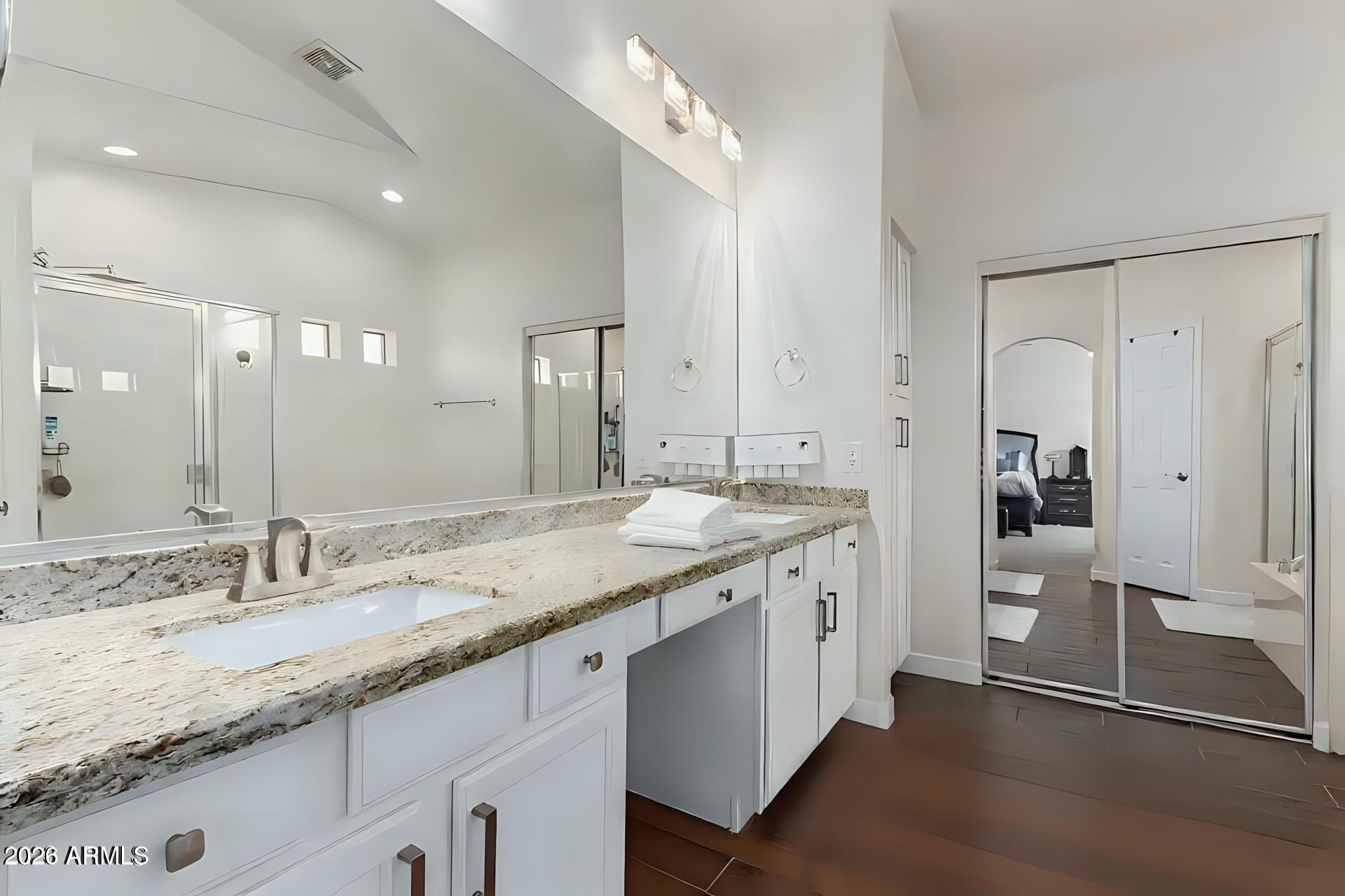 6435 South Beckham Way Laveen, AZ 85339 - Photo 11 of 14 a bathroom with a granite countertop sink and a mirror