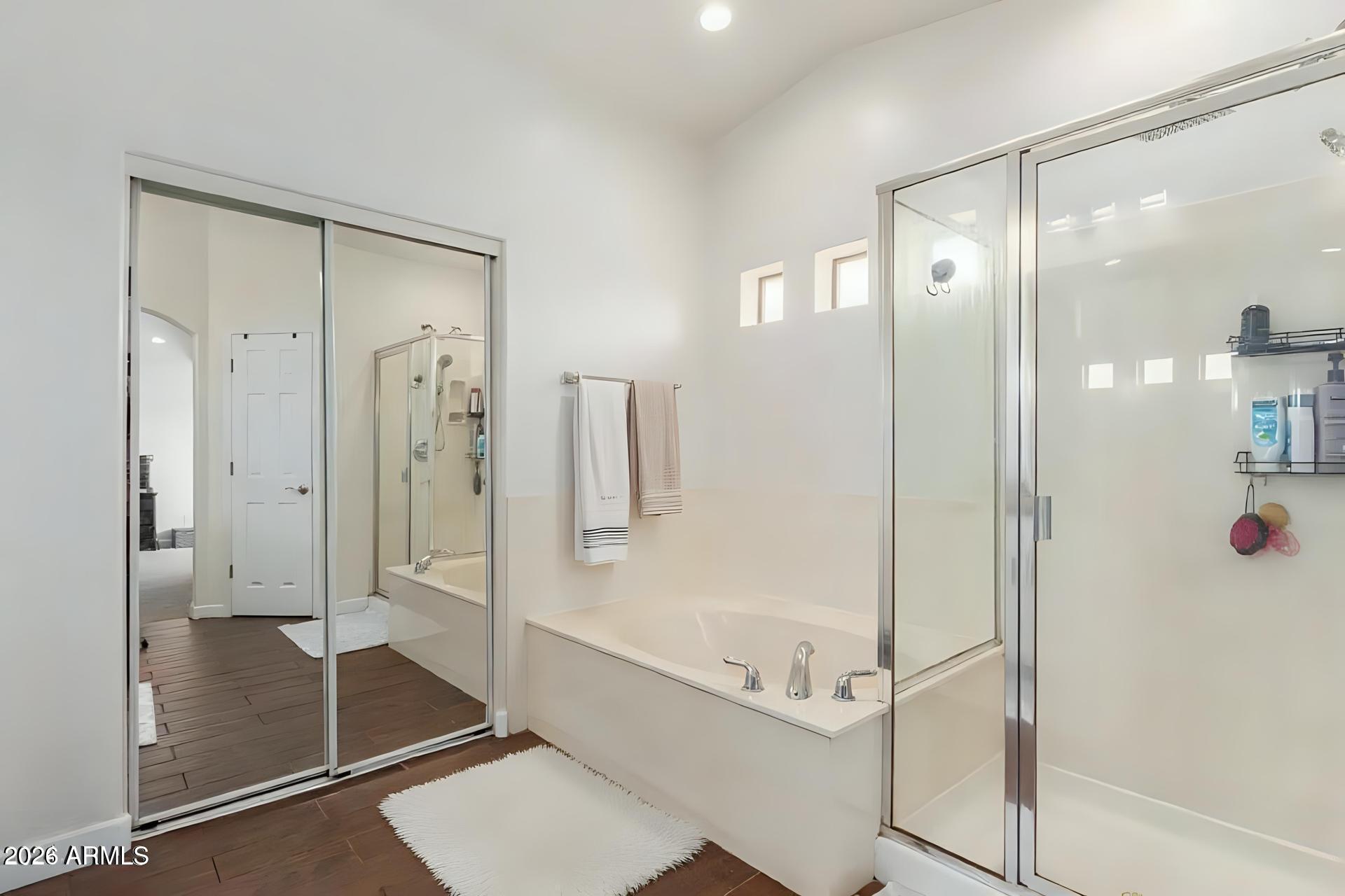 6435 South Beckham Way Laveen, AZ 85339 - Photo 12 of 14 a bathroom with a glass shower door and a glass door shower