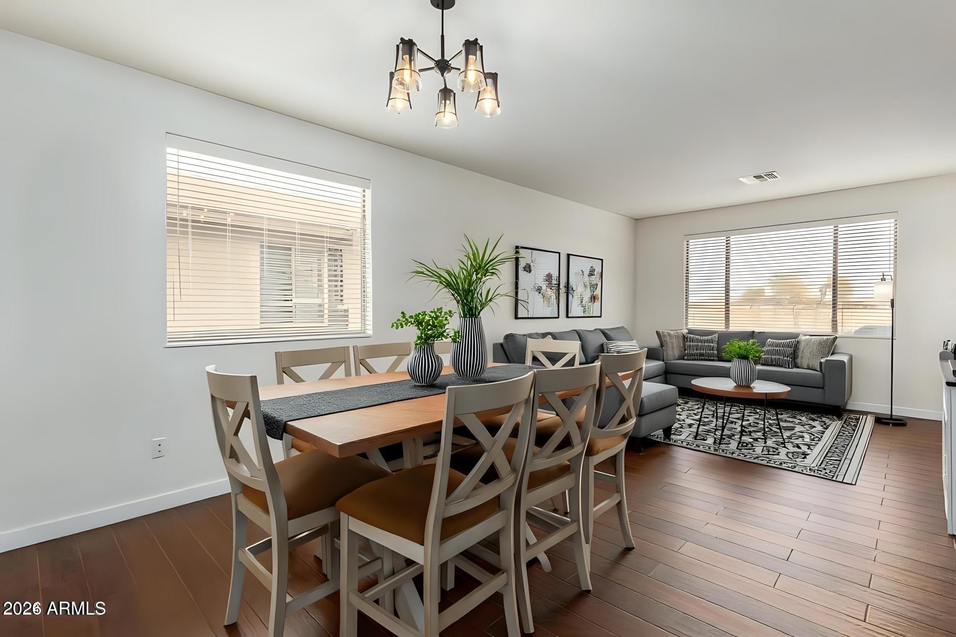 6435 South Beckham Way Laveen, AZ 85339 - Photo 4 of 14 a view of a dining room with furniture window and wooden floor