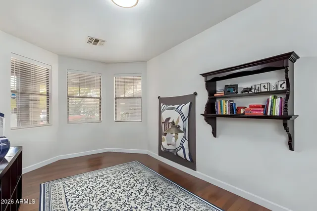 a view of a livingroom with furniture and a flat screen tv