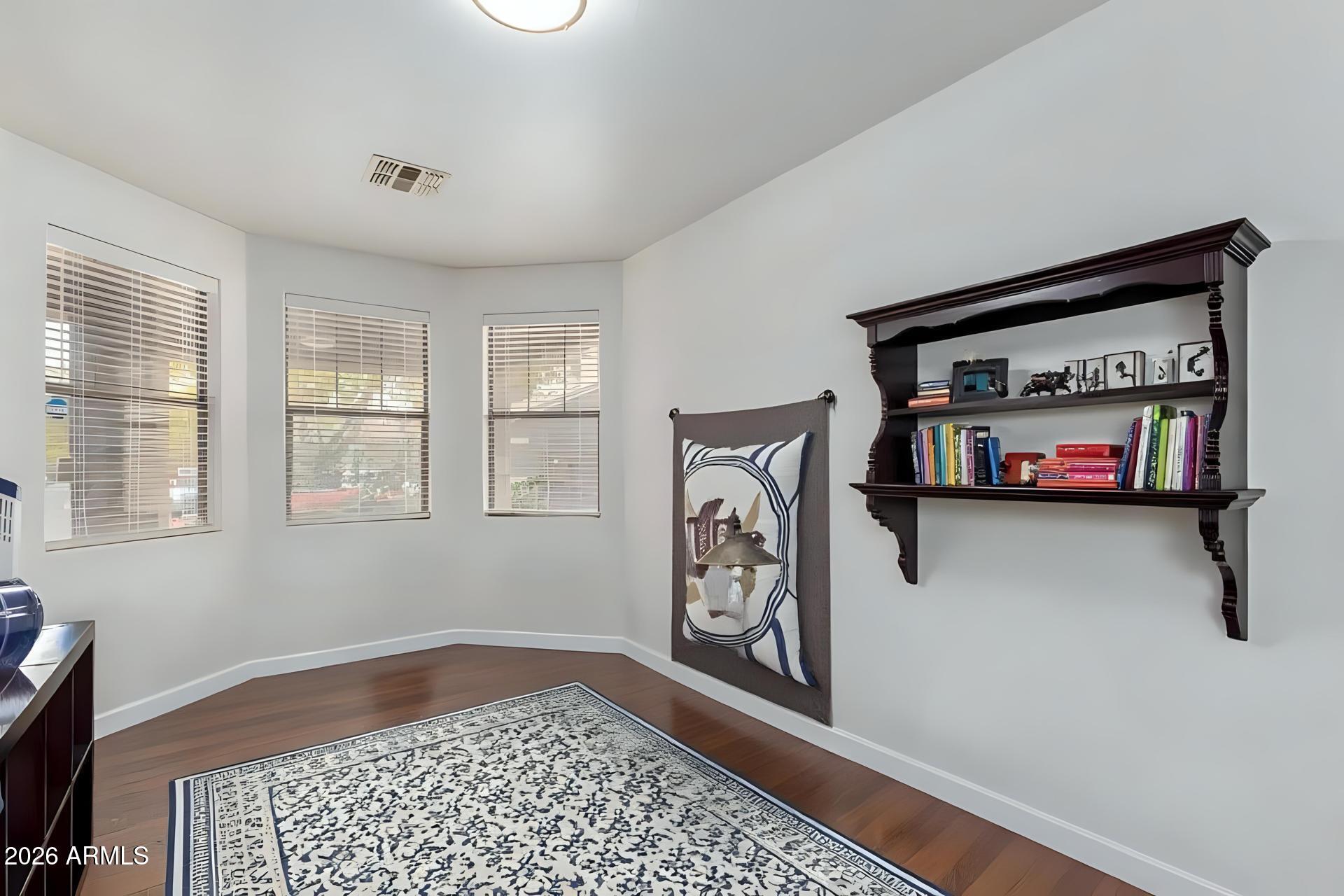 6435 South Beckham Way Laveen, AZ 85339 - Photo 6 of 14 a view of a livingroom with furniture and a flat screen tv