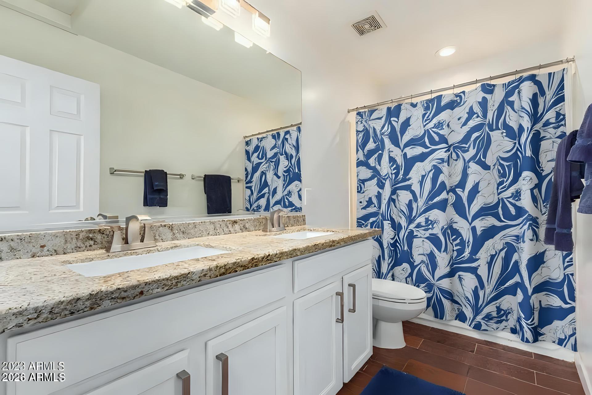 6435 South Beckham Way Laveen, AZ 85339 - Photo 8 of 14 a bathroom with a granite countertop sink and a mirror