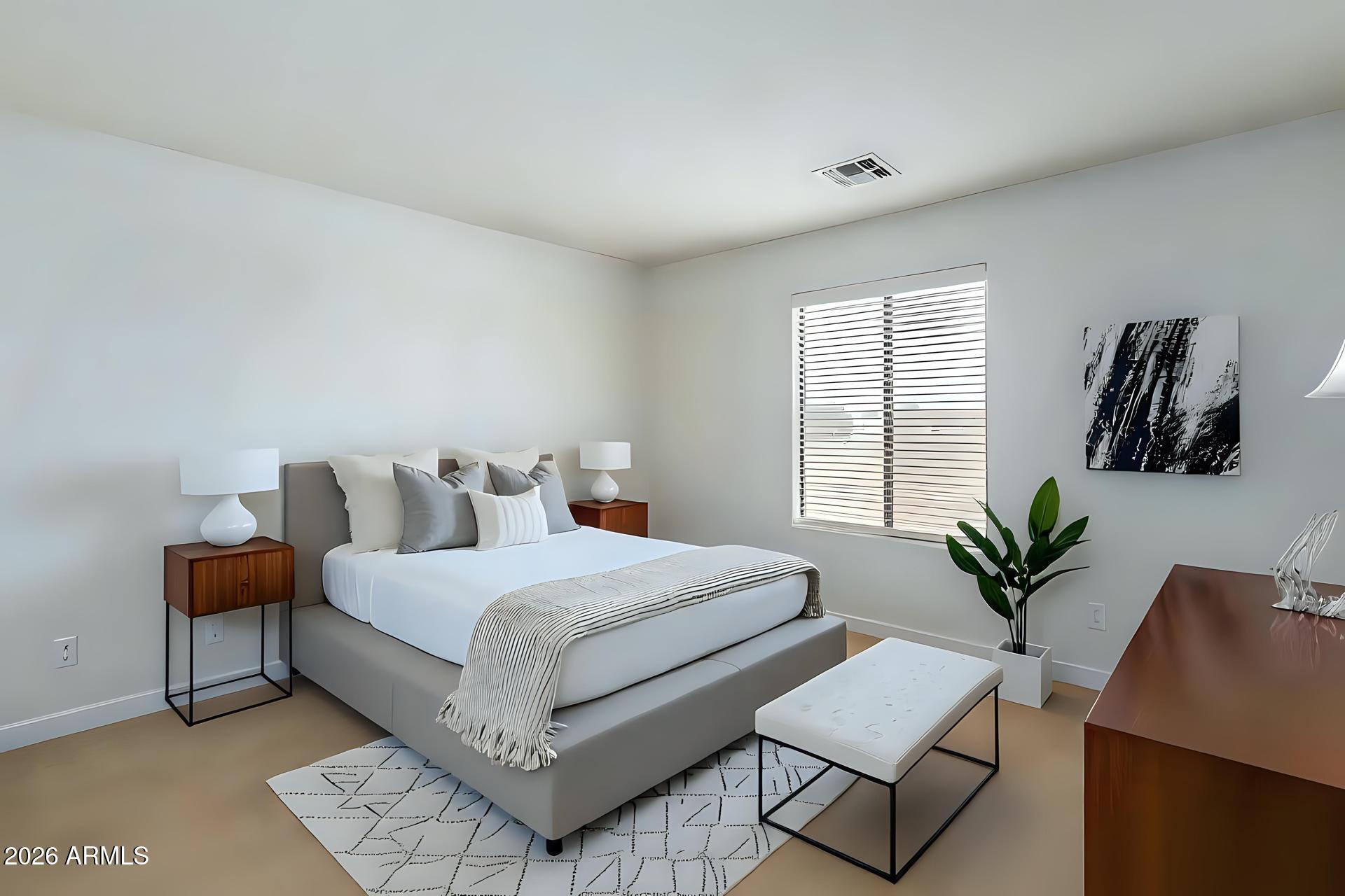 6435 South Beckham Way Laveen, AZ 85339 - Photo 9 of 14 a bedroom with a bed and window