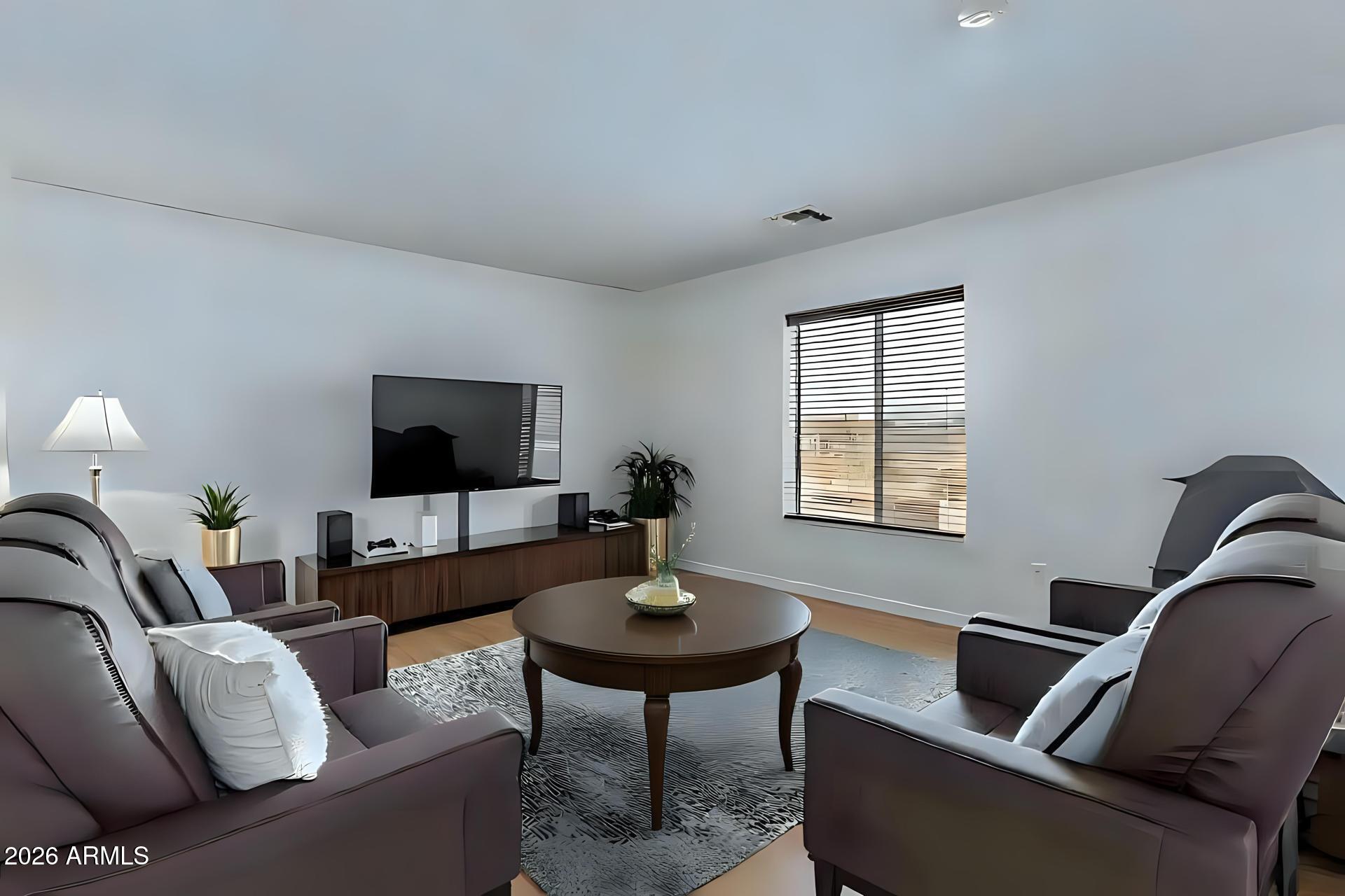 6435 South Beckham Way Laveen, AZ 85339 - Photo 10 of 14 a living room with furniture and a flat screen tv