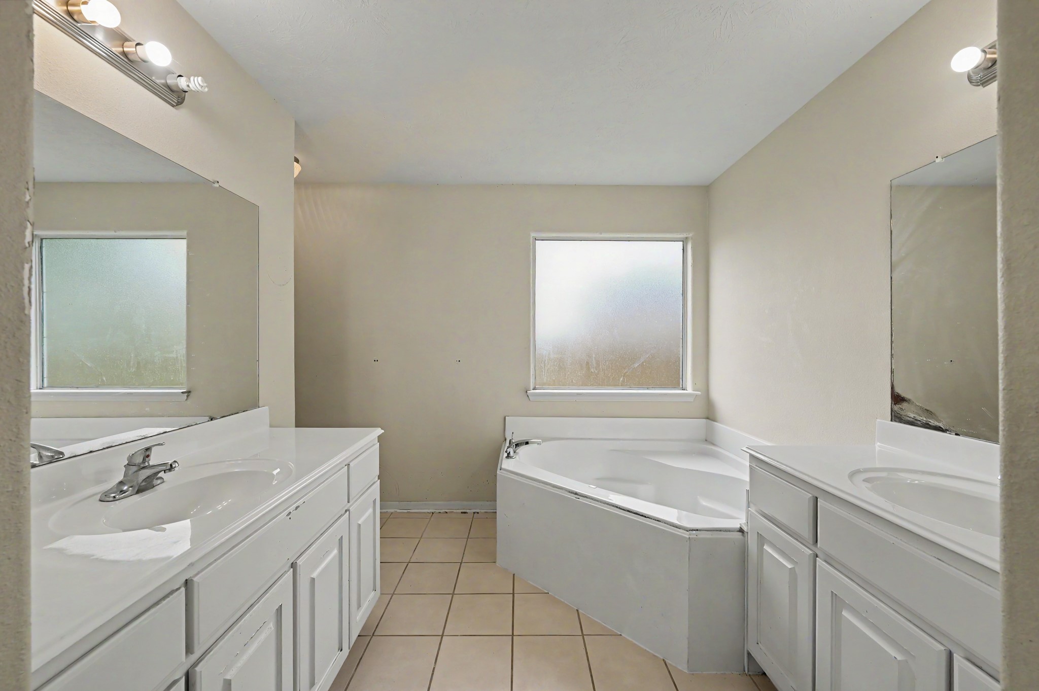 4619 Comal River Loop Spring, TX 77386 - Photo 12 of 16 The primary bathroom is spacious with two huge sink/vanities, a soaker tub, and a shower.