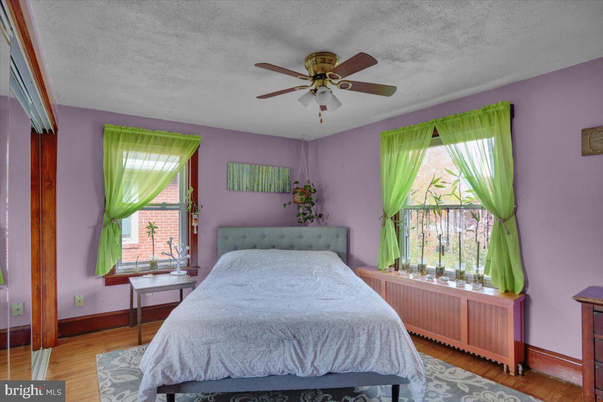 136 West Elm Street Reading, PA 19607 - Photo 17 of 23 a bedroom with a bed and a chandelier